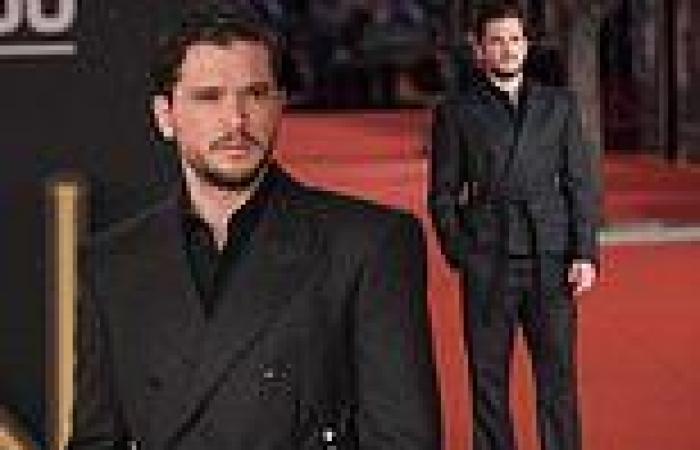 Kit Harington scrubs up in a black double breasted coat at Marvel's Eternals ...