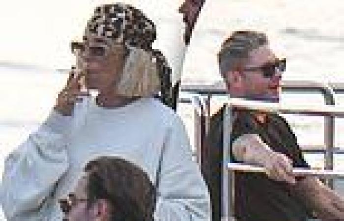 Pip Edwards puffs on a cigarette as she joins Michael Clarke aboard a luxury ...