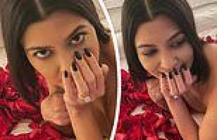 Kourtney Kardashian poses TOPLESS on rose petals seven days after Travis Barker ...
