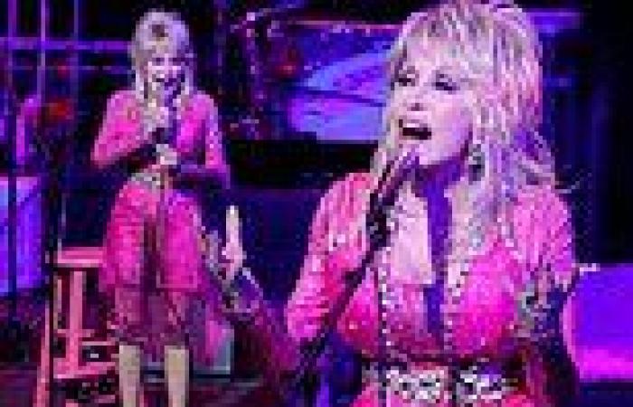 Dolly Parton rocks a bejeweled hot pink dress while performing at a charitable ...