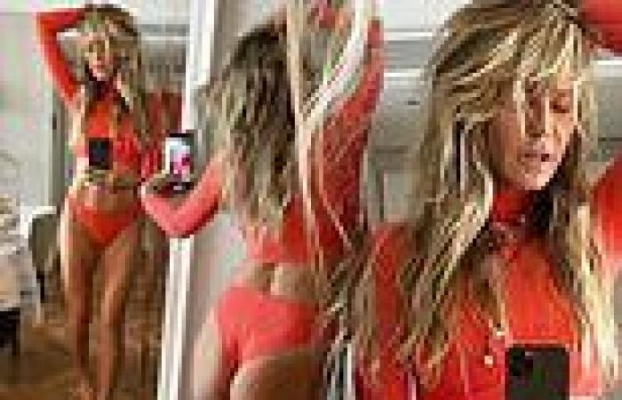 Heidi Klum flashes abs in orange crop top and briefs from Kim Kardashian's ...