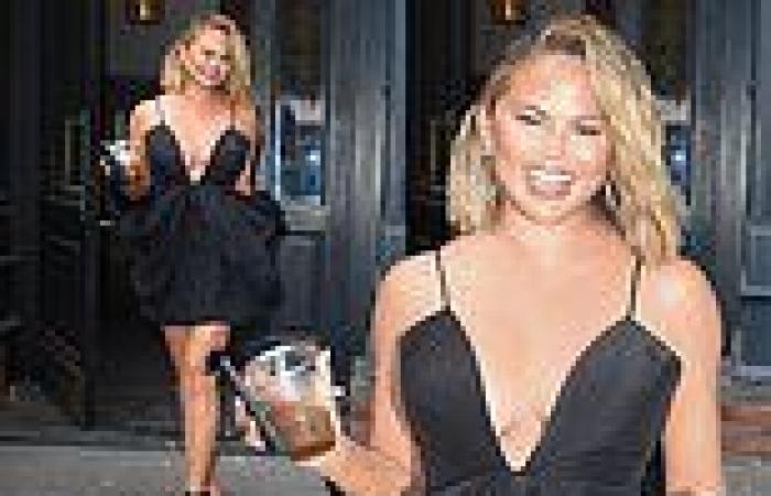 Chrissy Teigen puts on a busty display in a little black dress on her way to ...