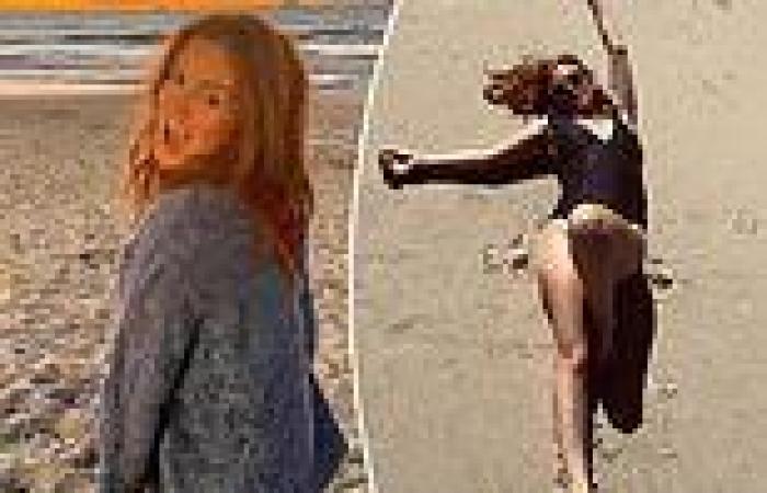 Isla Fisher relaxes on the sand in throwback photos from her recent holiday in ...