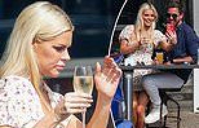 Sophie Monk enjoys a glass of wine in her flip-flops with fiancé Joshua Gross 