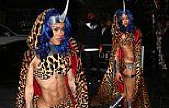 Teyana Taylor dons leopard print crop top and matching cape at Halloween party