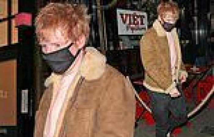 Ed Sheeran cuts a trendy figure in a tan shearling jacket as he exits London ...