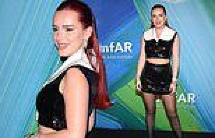 Bella Thorne flashes a glimpse of her toned midriff at the 2021 amfAR Gala in ...
