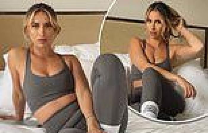 Ferne McCann flashes her washboard abs in a skintight grey gym set while posing ...