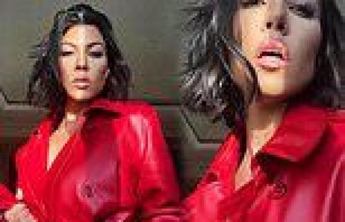 Kourtney Kardashian models a red coat with nothing underneath