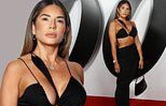 Busty businesswoman steals the show at No Time To Die premiere