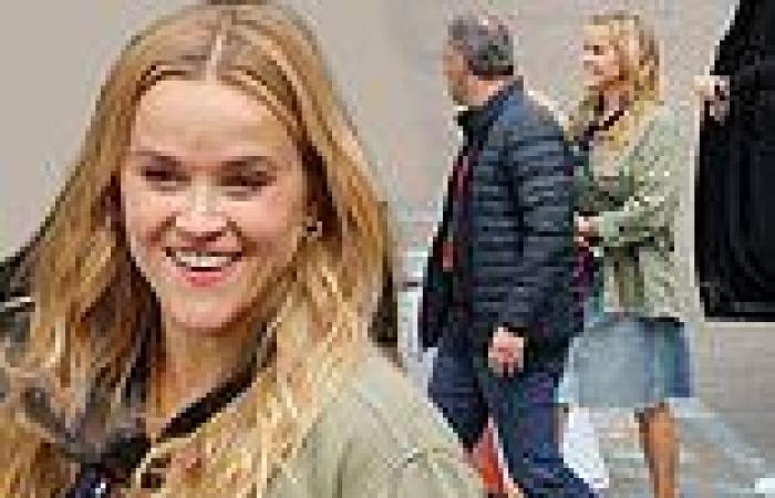 Reese Witherspoon beams ear-to-ear in a denim skirt as she films Your Place Or ...