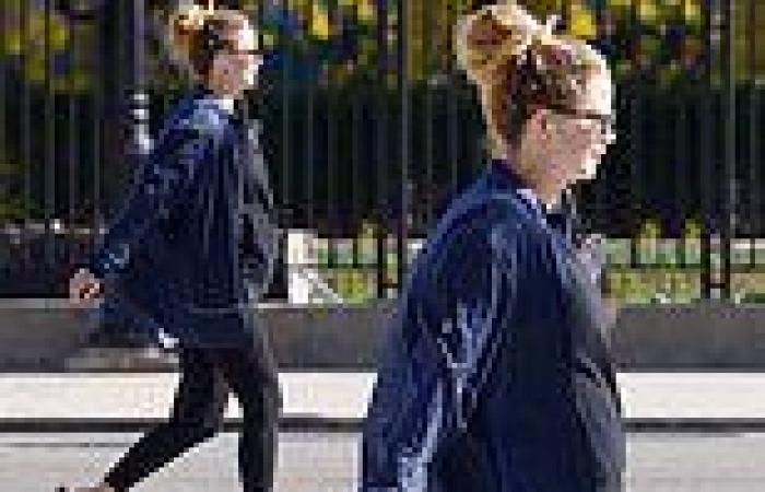 Jennifer Lawrence covers her burgeoning baby bump in a fleece while out and ...