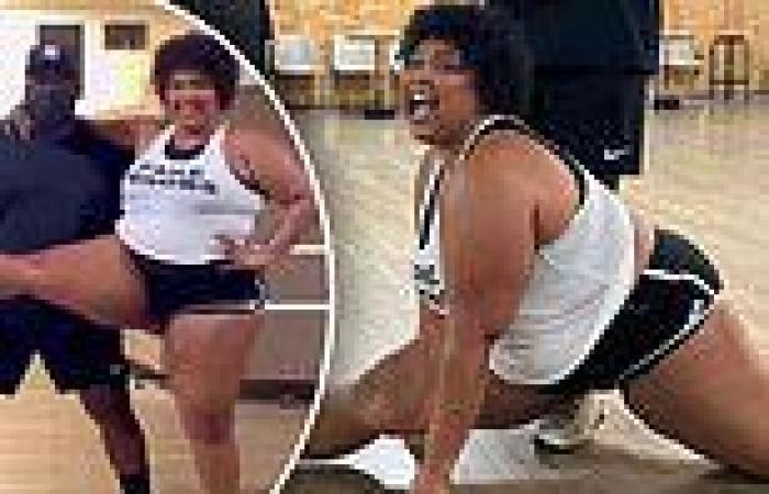 Lizzo gets closer to achieving her goal of doing the SPLITS as she gets low to ...