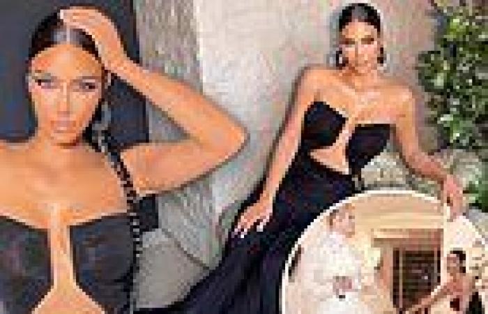 Kim Kardashian puts on busty display in her stunning strapless black gown at ...