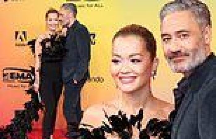 Rita Ora wows in a feathered jumpsuit as she cosies up to Taikia Waititi at ...