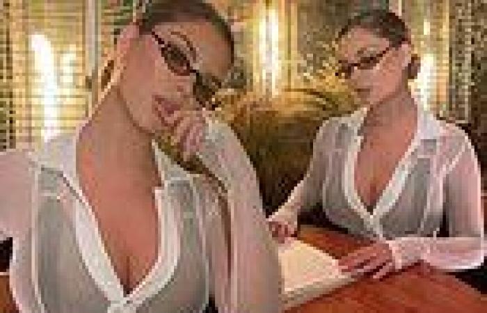 Demi Rose sizzles as she goes bra-less in a see though cropped shirt