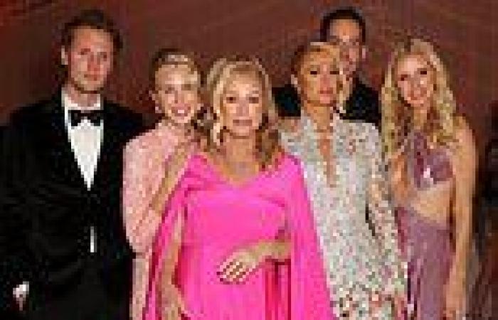 Hilton family portrait: Kathy Hilton stands out in pink as she poses with her ...