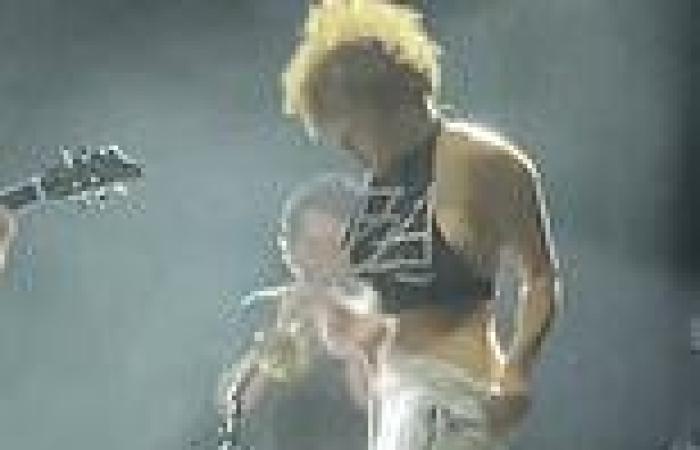 Rock group frontwoman Sophia Urista URINATES on a fan's face on stage in front ...
