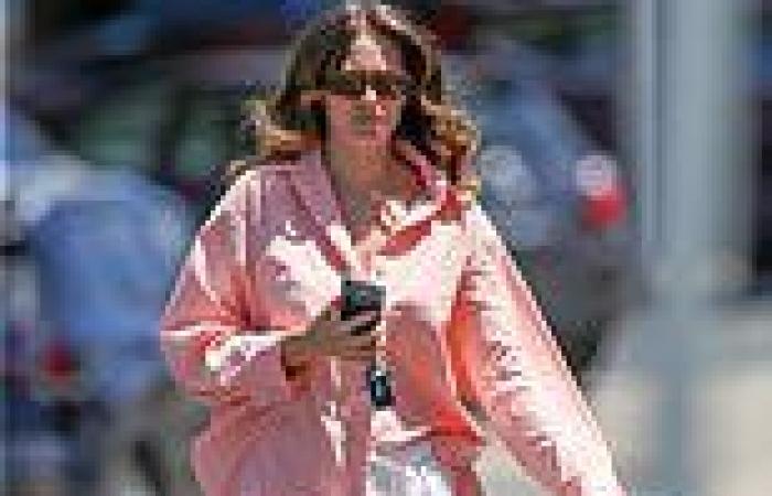 Jesinta Franklin looks stunning in a silky pink blouse as she enjoys a ...