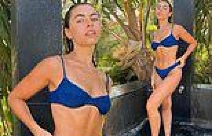 Francesca Allen flashes her cleavage in navy bikini for steamy outdoor shower