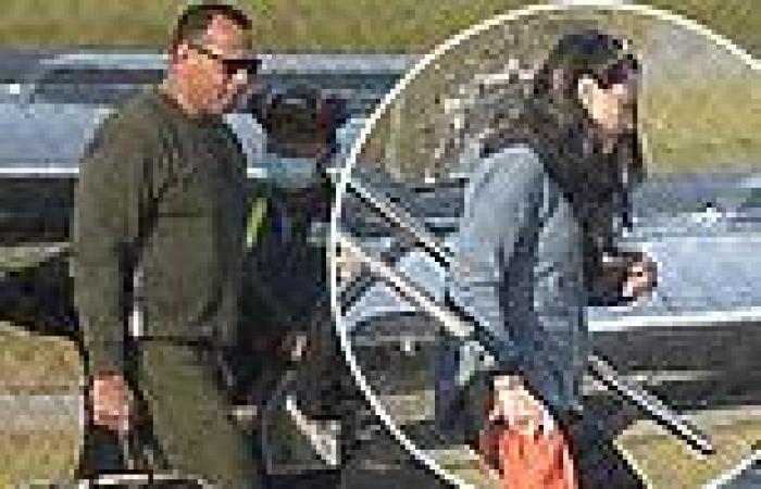 Alex Rodriguez exits his plane with a female companion in New York after Kelly ...