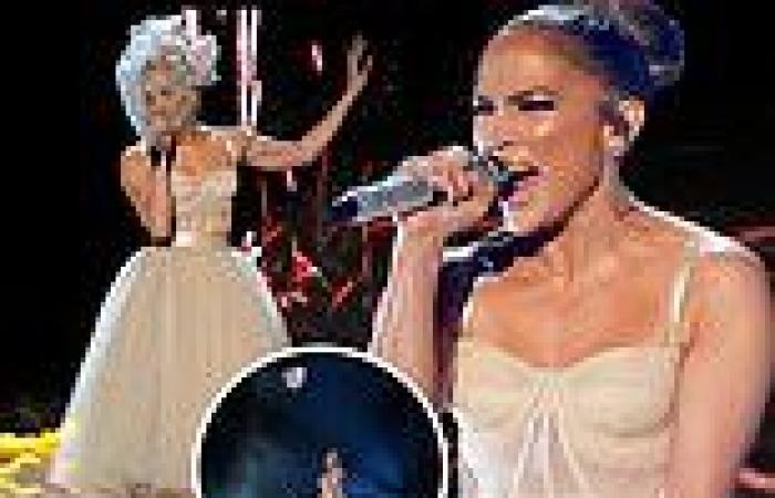 Jennifer Lopez performs in a WEDDING dress but no sign of Ben Affleck at AMAs