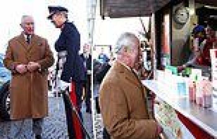 Prince Charles chats with market traders in Cambridge