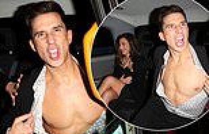Russell Kane shows off his toned torso as he and wife Lindsey Cole attend Kelly ...