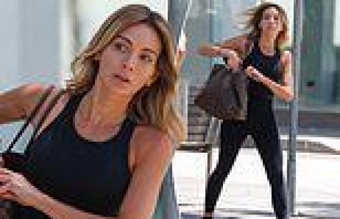 Nadia Bartel dresses in head-to-toe black athleisure wear as the WAG runs ...
