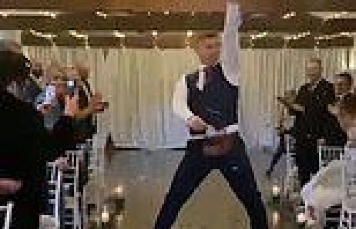 Flower boy has wedding guest in hysterics as he struts and wiggles down the ...