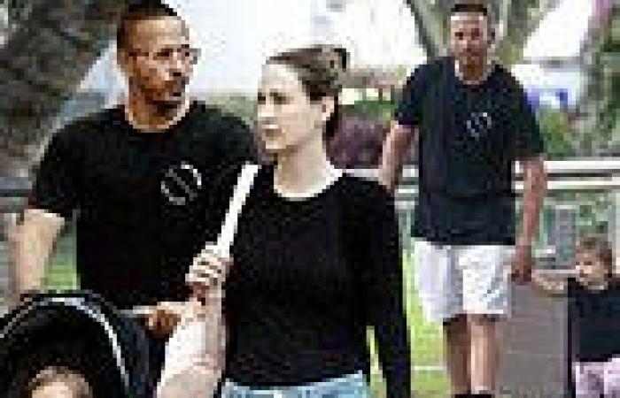 Cricketer Usman Khawaja is seen with his pregnant wife Rachel and daughter Aisha