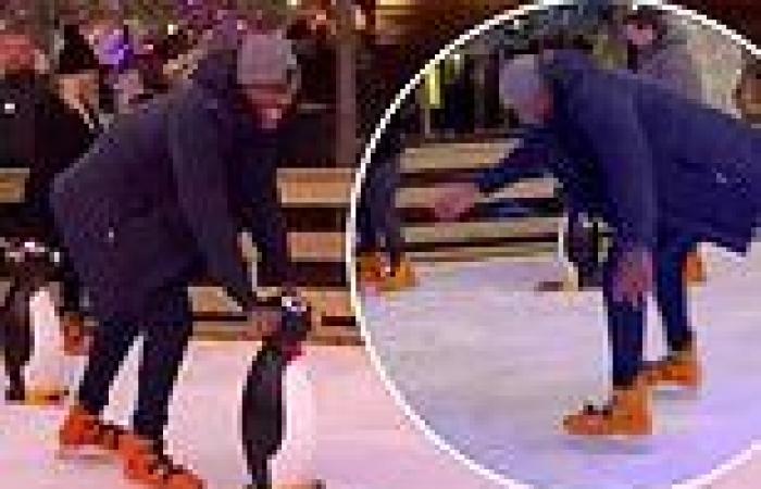 Anthony Joshua uses penguin balancing aid after nearly taking a tumble while ...