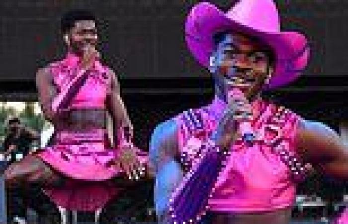 Lil Nas X  bares six-pack abs in metallic pink crop top and skirt with cowboy ...