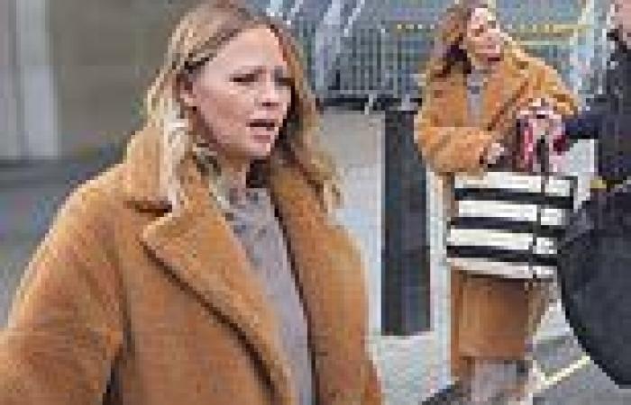 Kimberley Walsh looks casually chic in a fur coat after a festive appearance on ...