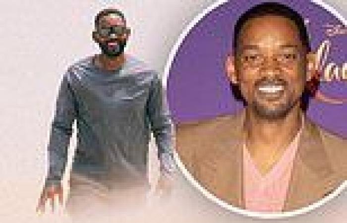 Will Smith smiles big while partially obscured in a dust cloud during shot for ...
