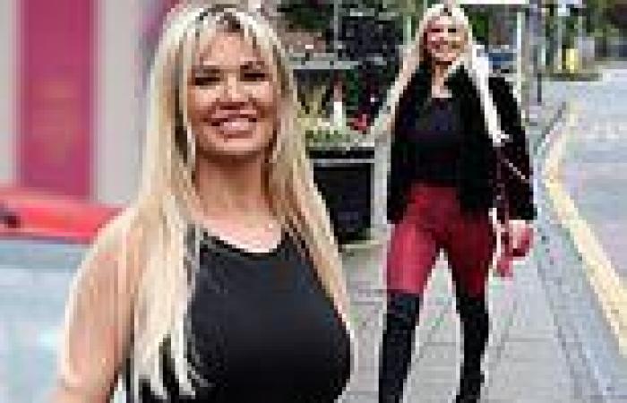 Christine McGuinness displays her gym-honed physique in skinny red snake print ...