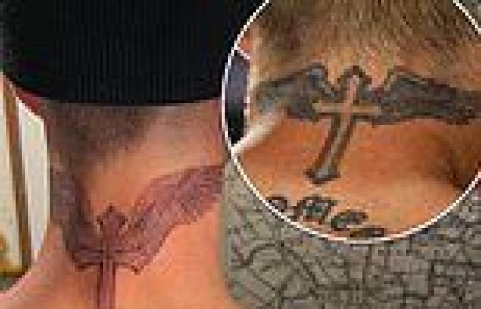 Romeo Beckham, 19, mimics dad David as he debuts huge winged cross tattoo on ...