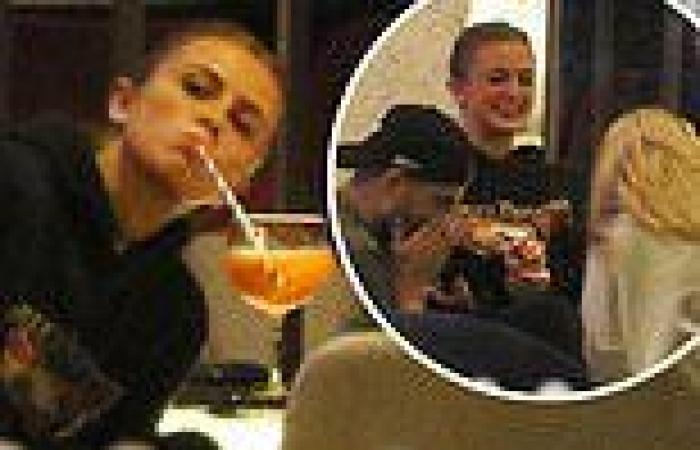 Maisie Smith puts on an animated display as she enjoys cocktails