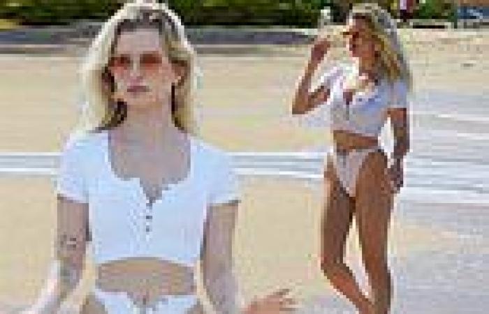 Lottie Moss flaunts her incredible figure in a skimpy white crop top on her ...