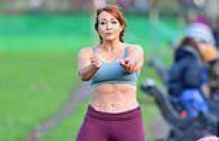 Apprentice star Amy Anzel, 48, shows off her abs in a sports bra during park ...