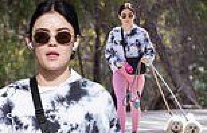 Lucy Hale stays comfortable in a dual-tone hoodie and leggings while taking her ...