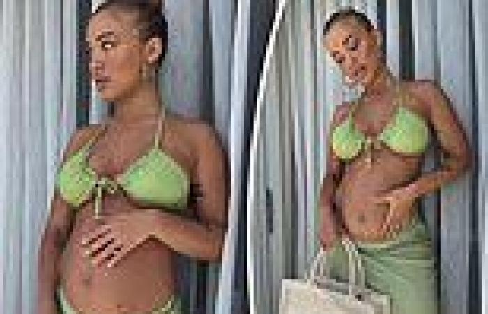Tammy Hembrow shows off her growing baby bump in a green bikini