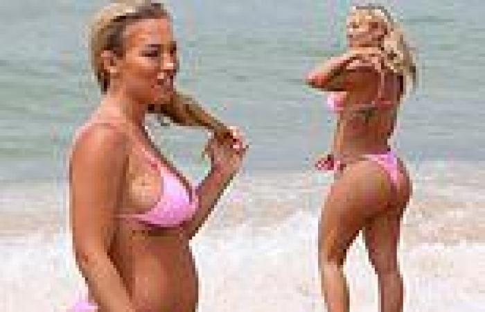 Tammy Hembrow flaunts her blossoming baby bump at Bondi