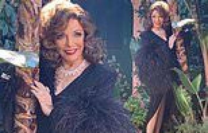 Dame Joan Collins, 88, puts on leggy display in figure-hugging feathered gown ...