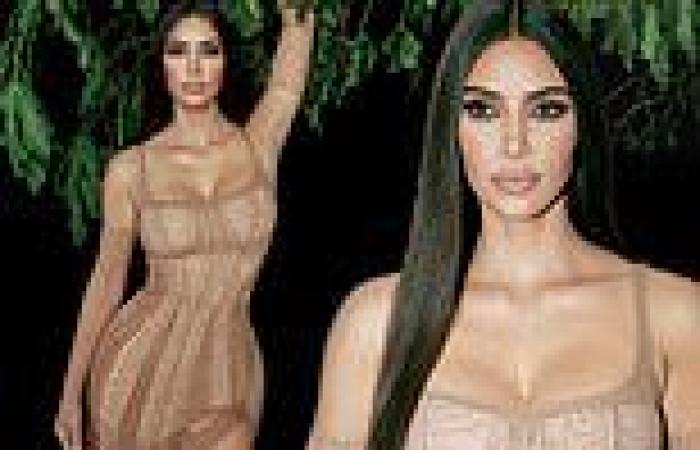 Kim Kardashian is breathtakingly beautiful in a sheer nude gown with matching ...