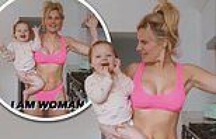Bikini-clad Danielle Armstrong shows off her taut abs as she dances in her ...