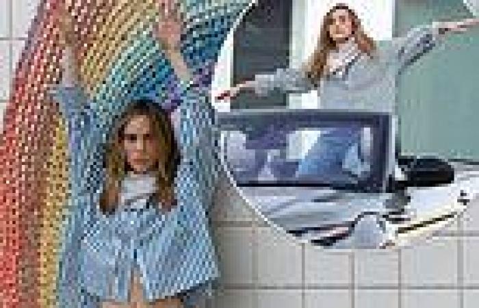 Suki Waterhouse shows off her toned midriff in cropped shirt as she larks ...