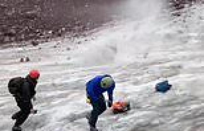 Group of climbers are sent diving for cover as boulder size of car crashes ...