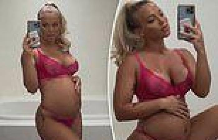 Tammy Hembrow flaunts her growing baby bump in racy pink lingerie