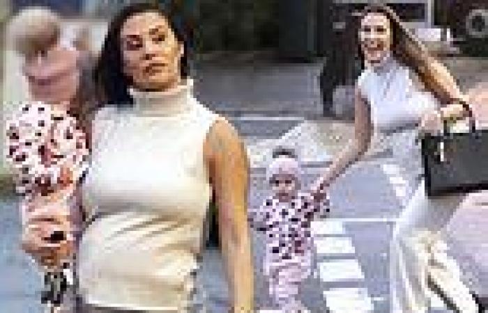 Chloe Goodman shows off her baby bump in cream sweater during adorable walk ...